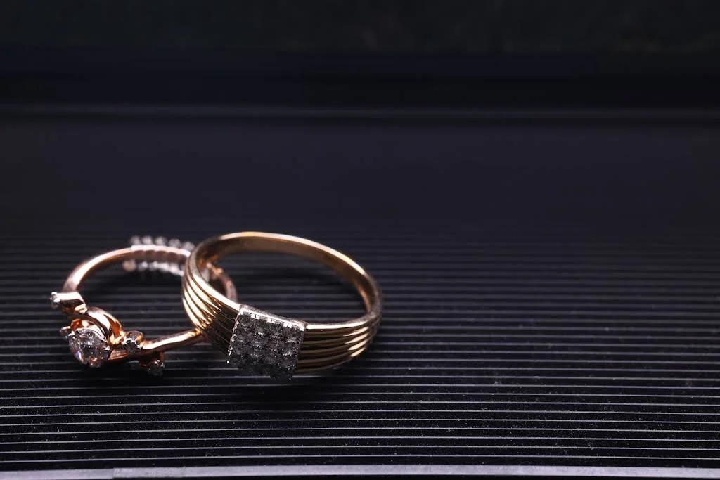 Two rings arranged together on a dark surface